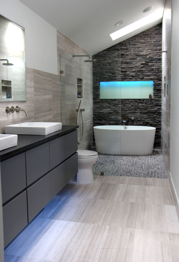 gray-striped-tile-floor-gray-vanity-with-drawers-black-counter-top-white-ceramic-sinks-wall-mount-faucets-frameless-glass-enclosure-tub-inside-of-shower