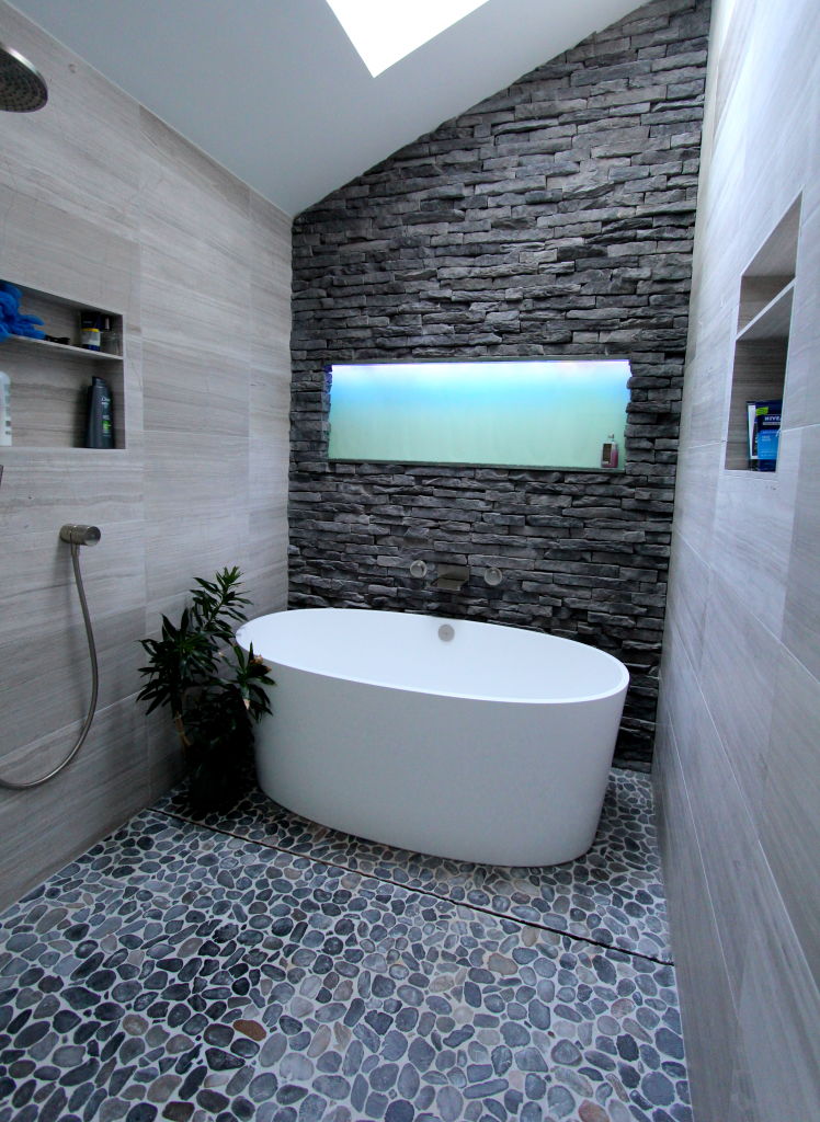 Victoria-and-Albert-bathtub-with-back-lit-glass-shelf-above-tub-and-splish-splash-hidden-drain-system